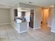 Open living space featuring a granite breakfast bar and tile floors, great for entertaining at 9831 Barley Club Dr # 8, Orlando, FL 32837