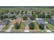 An aerial view of the home within its neighborhood shows the property boundaries and community feel at 10138 Lenox St, Clermont, FL 34711