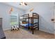 Fun bedroom with a bunk bed and decor, perfect for a or guest room at 10138 Lenox St, Clermont, FL 34711