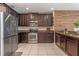 Well-equipped kitchen featuring stainless steel appliances, sleek countertops, and ample cabinet space at 10138 Lenox St, Clermont, FL 34711