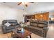 Open living area with comfortable seating, stylish furnishings, and seamless access to the modern kitchen and dining area at 10138 Lenox St, Clermont, FL 34711