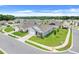 Aerial view of homes in a suburban neighborhood with well-maintained lawns and tree-lined streets at 11284 Amber Ridge Dr, Zellwood, FL 32798