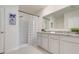 Clean bathroom with double vanity, granite countertop, and a shower with curtain at 11284 Amber Ridge Dr, Zellwood, FL 32798