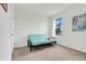 Simple bedroom featuring a futon, carpet flooring, and a bright window at 11284 Amber Ridge Dr, Zellwood, FL 32798
