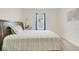 Bright bedroom featuring a large bed, neutral walls and lovely natural light from the window at 11284 Amber Ridge Dr, Zellwood, FL 32798