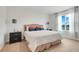 Cozy bedroom with a comfortable bed, neutral colors, and bright natural light at 11284 Amber Ridge Dr, Zellwood, FL 32798