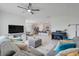 Open concept living room flowing into the kitchen and dining areas at 11284 Amber Ridge Dr, Zellwood, FL 32798