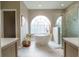 Spacious bathroom with stand alone tub, natural light, and tiled shower at 1161 Coastal Cir, Ocoee, FL 34761