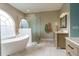 Large bathroom with free standing tub and glass shower at 1161 Coastal Cir, Ocoee, FL 34761
