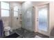 Modern bathroom with a frameless glass shower, stylish tile, and updated fixtures for a spa-like experience at 1161 Coastal Cir, Ocoee, FL 34761
