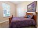 Comfortable bedroom with a plush bed, window, and closet, creating a peaceful retreat at 1161 Coastal Cir, Ocoee, FL 34761