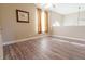 Open bonus room with light filled windows and wood flooring at 1161 Coastal Cir, Ocoee, FL 34761