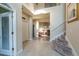 Spacious foyer with tile flooring, staircase with wood treads, and natural light filling the living space at 1161 Coastal Cir, Ocoee, FL 34761