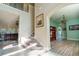 Open-concept foyer with staircase, leading to the living room and office space, creating an inviting atmosphere at 1161 Coastal Cir, Ocoee, FL 34761
