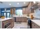 Contemporary kitchen with ample counter space, and dining area featuring stainless appliances and custom cabinets at 1161 Coastal Cir, Ocoee, FL 34761
