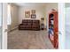 Relaxing living room featuring a comfortable sofa, built-in bookshelf, and an inviting atmosphere at 1161 Coastal Cir, Ocoee, FL 34761