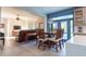 Open floor plan showcasing the living room and kitchen with seamless flow and abundant natural light at 1161 Coastal Cir, Ocoee, FL 34761