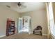 Cozy office space with neutral tones and French doors, creating a functional and inviting workspace at 1161 Coastal Cir, Ocoee, FL 34761