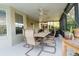Covered patio area featuring neutral-colored furniture, ideal for outdoor dining and relaxation at 1161 Coastal Cir, Ocoee, FL 34761