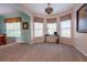 Sitting area with lots of natural light and plush carpet at 1161 Coastal Cir, Ocoee, FL 34761