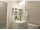 Cozy bathroom featuring new vanity, mirror, and lighting fixtures, creating a clean and inviting space at 1220 Dustin Dr, Lady Lake, FL 32159
