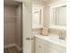 Well-maintained bathroom with updated vanity, mirror, fixtures, and walk-in closet providing ample storage at 1220 Dustin Dr, Lady Lake, FL 32159