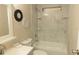 Updated bathroom featuring a new shower with tile surround and modern fixtures creates a spa-like experience at 1220 Dustin Dr, Lady Lake, FL 32159