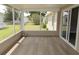 Relaxing screened porch with natural light and outdoor views for enjoying leisure time at 1220 Dustin Dr, Lady Lake, FL 32159