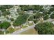 Neighborhood aerial view showcasing the property's location within a community with mature trees and convenient road access at 1244 Woodland Ave, Lakeland, FL 33801
