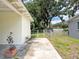 Backyard showing a fenced area and access from the carport to the outdoor space at 1244 Woodland Ave, Lakeland, FL 33801