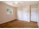 Bedroom showcasing neutral walls, overhead light with fan and 2 doors for closet space at 1244 Woodland Ave, Lakeland, FL 33801