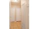 Hallway with neutral walls, tile flooring, and doors leading to other rooms at 1244 Woodland Ave, Lakeland, FL 33801
