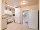 Functional kitchen with white cabinets, standard appliances, and an open layout at 1244 Woodland Ave, Lakeland, FL 33801