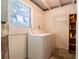 Laundry room featuring a washer and dryer and shelving for storage at 1244 Woodland Ave, Lakeland, FL 33801