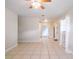 Bright living room featuring neutral walls, tiled floors, and natural light from a large window at 1244 Woodland Ave, Lakeland, FL 33801