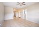 Bright living room featuring neutral walls, tiled floors, and natural light from a large window at 1244 Woodland Ave, Lakeland, FL 33801