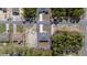 Aerial view of a home featuring a well-manicured lawn and inviting driveway at 13420 Sw 77Th Ave, Ocala, FL 34473