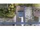 Aerial view of a property with a neatly paved driveway and well-maintained landscaping at 13420 Sw 77Th Ave, Ocala, FL 34473