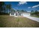 Well-maintained one-story home with a spacious driveway and a neatly landscaped front yard at 13420 Sw 77Th Ave, Ocala, FL 34473