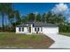 Charming one-story home featuring a well-manicured lawn and inviting front entrance at 13420 Sw 77Th Ave, Ocala, FL 34473