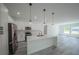 Bright kitchen features white cabinets, stainless steel appliances, and center island at 13420 Sw 77Th Ave, Ocala, FL 34473