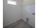 Clean laundry room space with hookups, shelving, and modern flooring at 13420 Sw 77Th Ave, Ocala, FL 34473