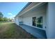 Covered patio space with an outdoor sink and sliding glass doors leading to interior at 13420 Sw 77Th Ave, Ocala, FL 34473