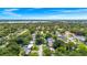 Scenic aerial view of the home, its surrounding neighborhood, and a lake providing a picturesque backdrop at 1408 Watts Ave, Orlando, FL 32809