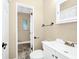 Clean bathroom with a sink, toilet and view of the tiled shower/tub combo at 1408 Watts Ave, Orlando, FL 32809