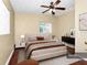 Virtual staging of bedroom with neutral tones, modern decor, and hardwood floors at 1408 Watts Ave, Orlando, FL 32809