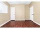 Neutral colored bedroom with wood look flooring and white trim at 1408 Watts Ave, Orlando, FL 32809