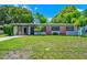 Inviting single-story home with well-maintained landscaping and brick accents at 1408 Watts Ave, Orlando, FL 32809
