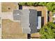 Aerial view of a home featuring a grey roof, a two-car garage, and screened in patio at 1415 Hensley Dr, Deland, FL 32724