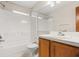 Bathroom featuring tub-shower combination and vanity with storage at 1415 Hensley Dr, Deland, FL 32724